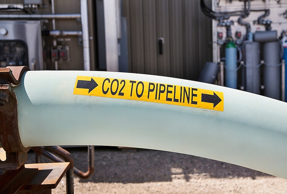Large pipe with CO2 pipeline sign